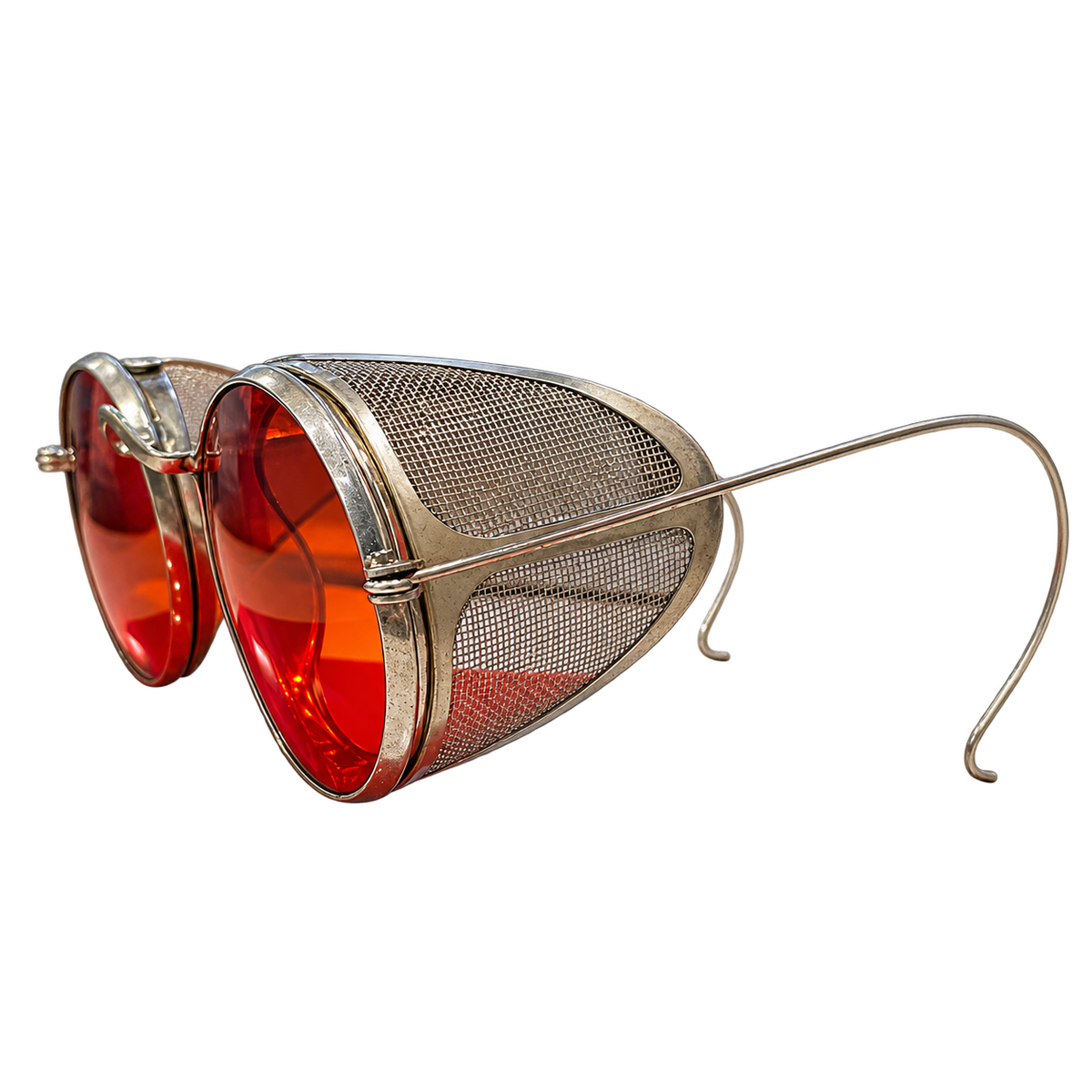 Angled view of vintage round red-lens eyeglasses with metal mesh side shields and cable temples