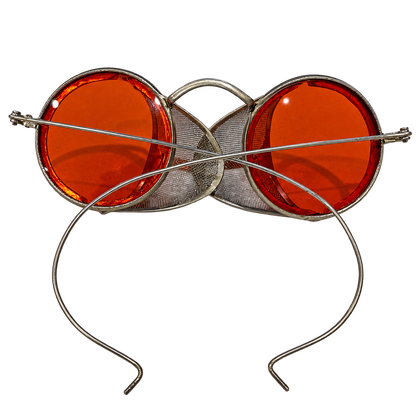 Rear view of vintage round red-lens eyeglasses with metal mesh side shields and cable temples